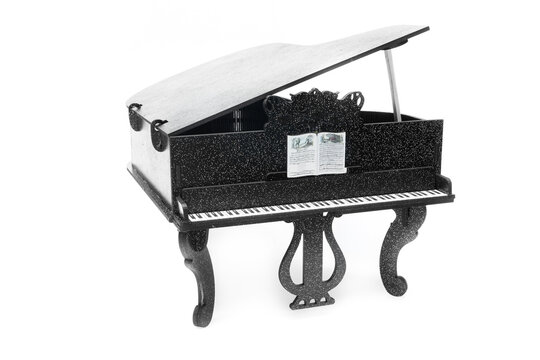 wooden toy piano model, classical vintage musical instrument. Isolated on a white background