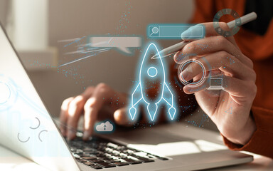 hand shows a rocket and an icon. Concept of Startup Business, Entrepreneurship Idea, and Online...