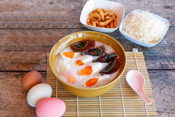 Congee, Rice porridge with minced pork, boiled egg, and century egg. Such a special Thai and Chinese breakfast ever