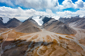 landscape with mountains, snow and glacier in highlands in Kyrgyzstan