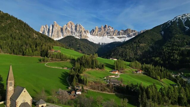 Spring landscape with Santa Magdalena village, Italian Dolomites Alps, in South Tyrol, Val di Funes, Italy, 4k