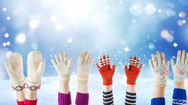 woolen children gloves and winter snow background