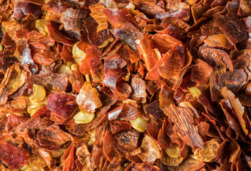 close-up of crushed dried chili pepper showing the fiery intensity and vibrant color of this popular spice