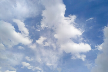 clear blue sky with fluffy clouds