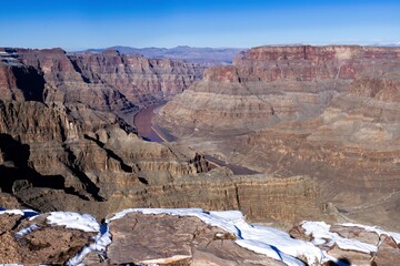 Grand Canyon Majesty: Red-Rock Formations with Colorado River in the Background