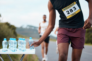 Hand, water and a marathon runner in a race or competition closeup for fitness or cardio on a...