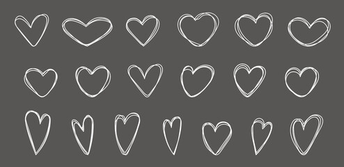 Set of scribble hearts drawn with chalk on a black board. Hearts doodles collection. Love symbol illustration. Set of hearts in line art style.