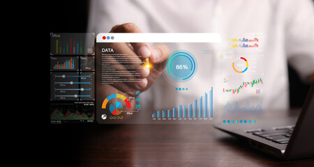 Data analyst working on business analytics dashboard with charts, with KPI and metrics connected to the database for technology finance, operations, sales, marketing