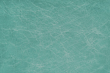 Genuine turquoise coarse textured leather, eco friendly leatherette background. Material for upholstery and interior design, sport items and clothes. Wallpaper, banner, backdrop.