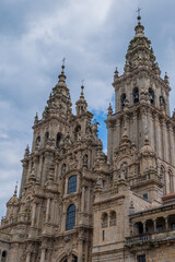 Fototapeta na wymiar Santiago de Compostela Cathedral on a cloudy day. Facade of the Obradoiro. Galicia, Spain