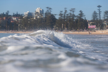 White water waves on the beach shore.