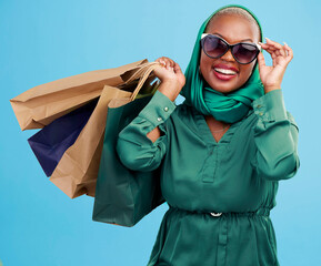 Studio bag, shopping and black woman excited for holiday fashion spree, commerce discount or...