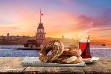 Naklejka premium Turkish Bagel, Traditional Pastries of Turkey and View of Istanbul Maiden's Tower