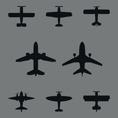 A set of airplane silhouettes. 8 pieces. Black silhouette. Vector on gray background.