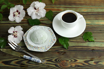 Colorful japanese sweets daifuku or mochi. Sweets close up on the plate with cup of coffee