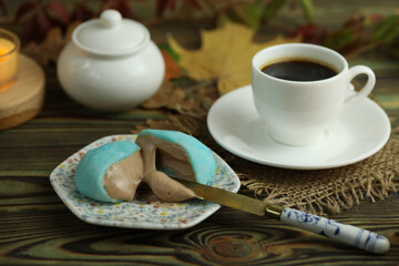 Colorful japanese sweets daifuku or mochi sliced. Sweets close up on the plate with cup of coffe