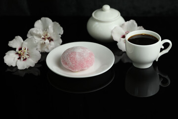 Obraz na płótnie Canvas Colorful japanese sweets daifuku or mochi sliced. Sweets close up on the plate with cup of coffee