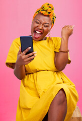 Celebration, winning and black woman excited for mobile app deal isolated in studio pink background...