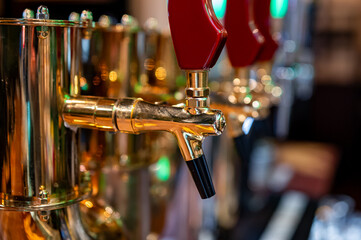 Fototapeta na wymiar many beer taps in bar or pub