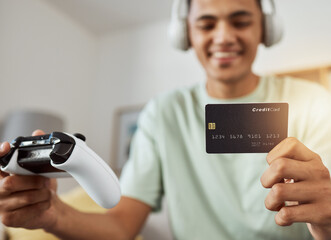 Headphones, credit card and man on esports video game ecommerce for purchase with controller in...