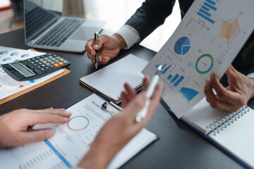 Meeting concept Business team hands at working with financial plan, meeting, discussion, brainstorm with tablet on the office desk.