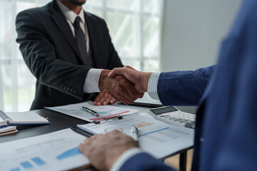 Business people shaking hands together, Business partnership handshake concept.Photo two coworkers handshaking process.Successful deal after great meeting