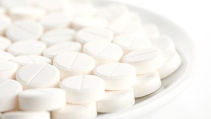 Fototapeta na wymiar White medical pills in plate. Pills and drugs. Pharmaceutical Industry