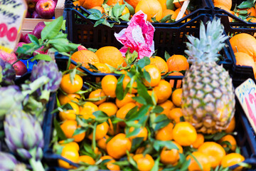 Naklejka na ściany i meble Open air market in Italy, different fruit. Madeira's fruits, pineapple lemon orange