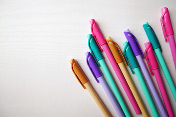 Colorful pencil crayons on a white marble background, Back to School text with colorful pencil crayons.