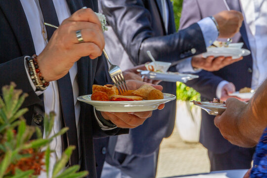 people eatingt the cattering at an event