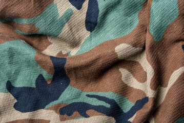 Military camouflage cloth pattern texture, alternating colors on a beautiful cloth background image.