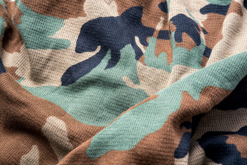 Military camouflage cloth pattern texture, alternating colors on a beautiful cloth background image.