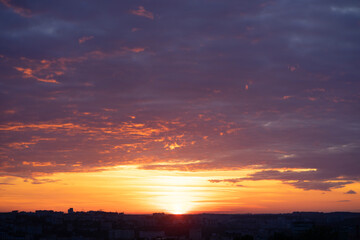 Orange colored dramatic sunset sky. Natural background
