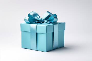 Obraz premium Elegant blue gift box with a shimmering ribbon on a pristine white background