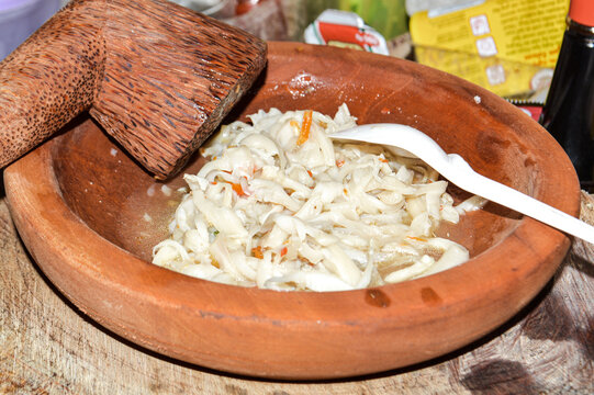 Close-up View Of Homemade Plecing Mushroom Dish On A Mortar And Pestle