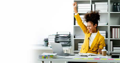 African american businesswoman happy and excited with job accomplished. female employee doing...