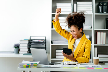 African american businesswoman happy and excited with job accomplished. female employee doing...