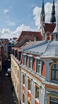 Roofs and spiers of cathedrals in the old city of Riga. Sunny day in the capital of Latvia. Historical center of ancient buildings.