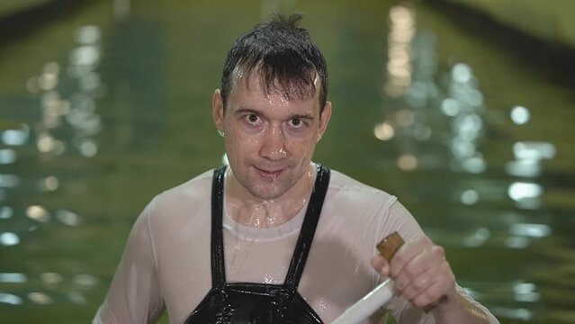 training in the pool. close-up of a man's face. slalom, kayaking. slow motion video. Record high quality video in Full HD format.