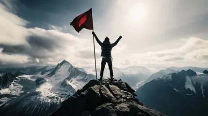 Foto op Canvas Man standing on top of mountain with flag, success leadership concept © IBEX.Media