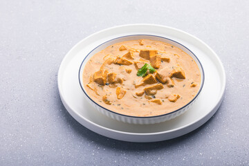 Delicious and creamy shahi paneer on a round plate for lunch