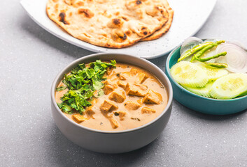 Delicious and creamy shahi paneer with roti and green salad