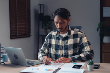 Businessman reading document to checking about financial and accounting report of business project