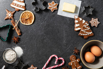christmas, food cooking and winter holidays concept - close up of iced gingerbread cookies, molds,...