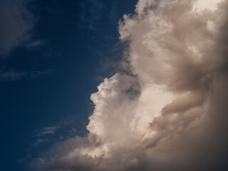 white rain clouds over countryside in summer