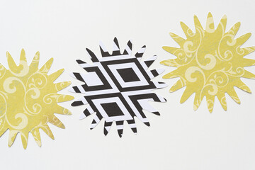 spiral or starburst paper shapes machine-cut from decorative floral and paisley and geometric...