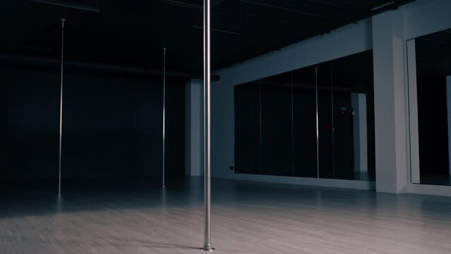 interior of empty dance hall with pylons sport hobby active lifestyle