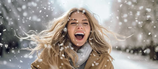 Foto op Plexiglas winter snow travel vacation laugh smiling cheerful woman female traveller happiness fun playing with snow fall in snow resort © VERTEX SPACE