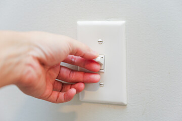 light switch in a dimly lit room, showcasing anticipation, connection, and the power of choice