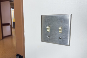 light switch in a dimly lit room, showcasing anticipation, connection, and the power of choice